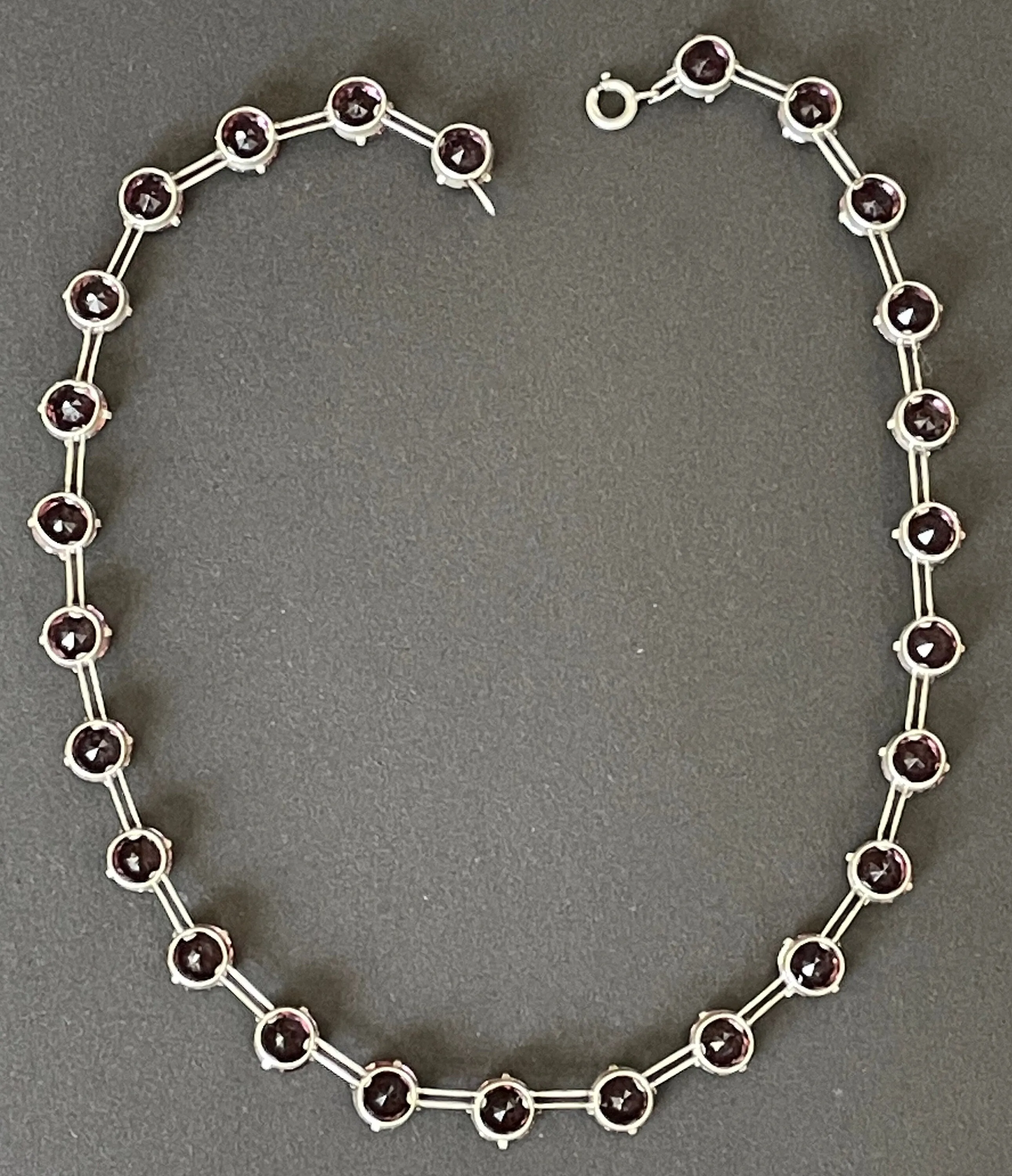 Vintage sterling silver Art Deco ruby pink / amethyst purple chaton cut crystal rhinestone riviere necklace bezel set, open backed, by W H Collins